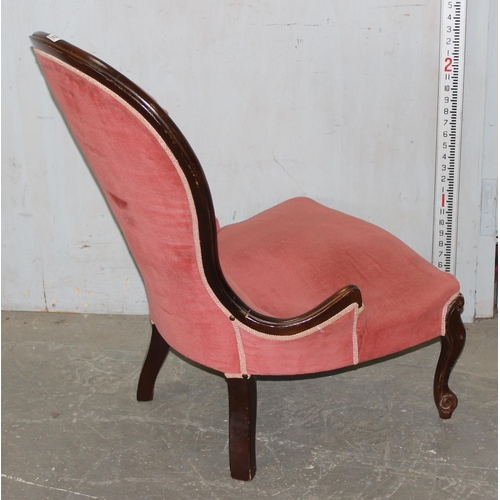 63 - A vintage pink upholstered button backed nursing chair with mahogany frame