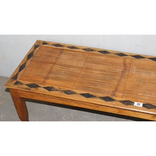 80 - A long slatted wooden window seat with geometric decoration, approx 150cm wide