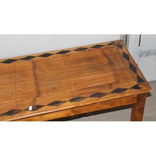 80 - A long slatted wooden window seat with geometric decoration, approx 150cm wide