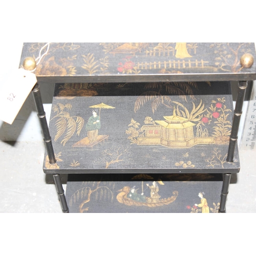 82 - A 20th century Chinoiserie 3 tier stand with bamboo effect supports