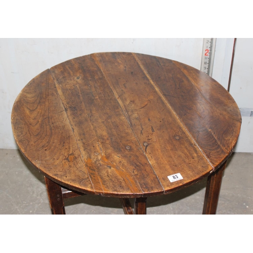 83 - An antique elm table with unusual folding base, believed to be 18th century or earlier