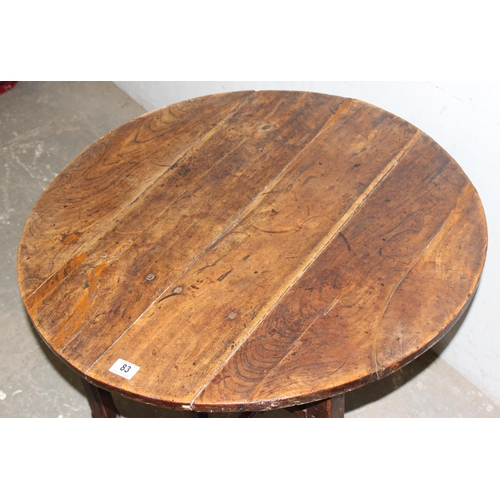 83 - An antique elm table with unusual folding base, believed to be 18th century or earlier