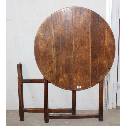 83 - An antique elm table with unusual folding base, believed to be 18th century or earlier