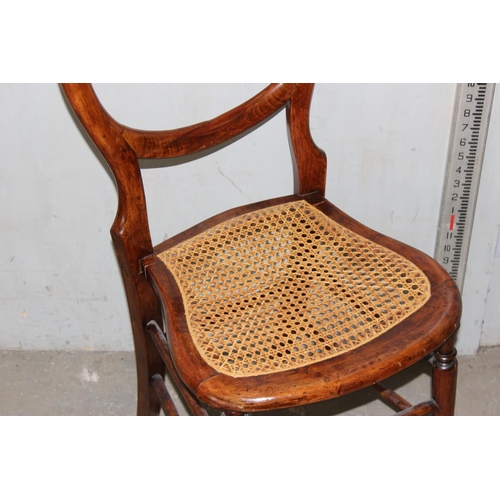 84 - An antique bergere seated bedroom chair