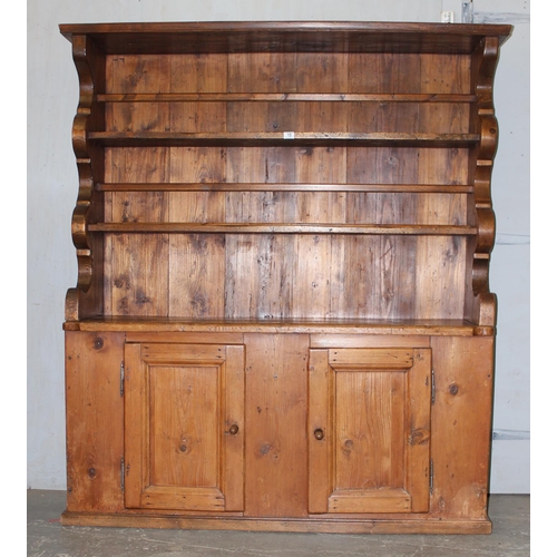 15 - A large antique pine kitchen dresser of unusual form, likely 19th century, approx 155cm wide x 180cm... 