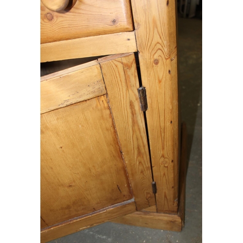 16 - A Victorian pine dresser base or sideboard with 3 central drawers flanked by 2 cupboards and 2 drawe... 