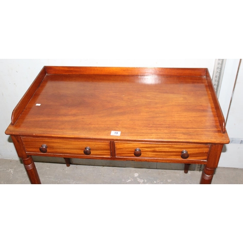 19 - A small antique mahogany desk with 2 drawers, approx 92cm wide