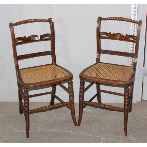 30 - A pair of unusual cane seated bedroom chairs with brass mounts and scumbled painted finish