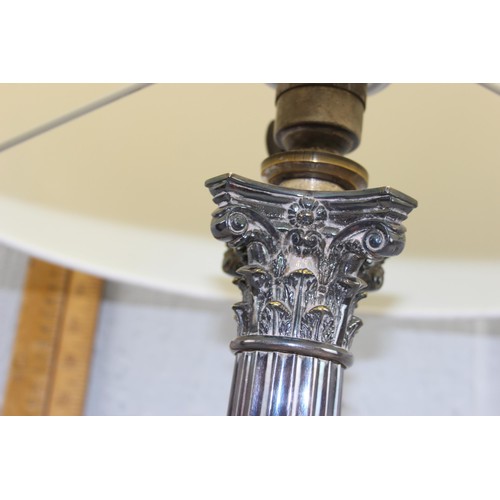 240 - A large vintage silver plated table lamp formed as a Corinthian column, with shade