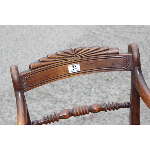 34 - A very well turned bobbin framed antique arm chair with bergere seat