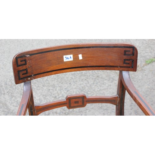 34a - A Georgian mahogany elbow chair with geometric ebony type inlay