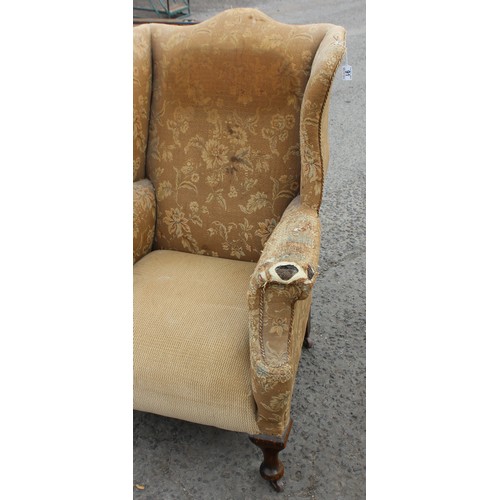 91 - An antique wing back arm chair with sprung seat, horse hair stuffing and good ceramic castors