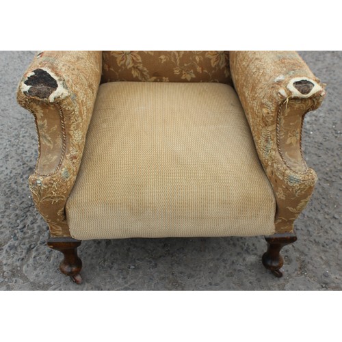 91 - An antique wing back arm chair with sprung seat, horse hair stuffing and good ceramic castors