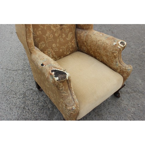 91 - An antique wing back arm chair with sprung seat, horse hair stuffing and good ceramic castors