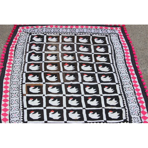 229G - An interesting vintage patchwork quilt decorated with swans and metal discs, approx 210cm x 145cm