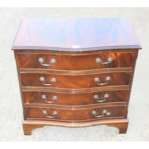 148 - A 20th century mahogany effect serpentine 4 drawer chest of drawers