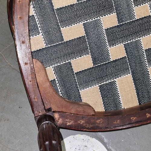 62 - An early 19th century shield backed armchair with dark green leather upholstery