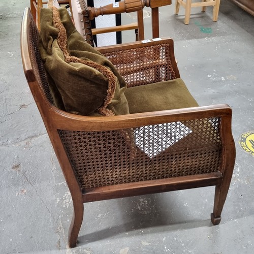 177 - A pair of Edwardian Regency revival style Bergere armchairs with cushions