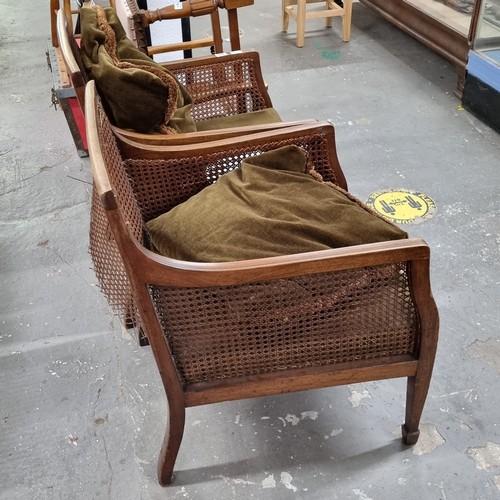 177 - A pair of Edwardian Regency revival style Bergere armchairs with cushions