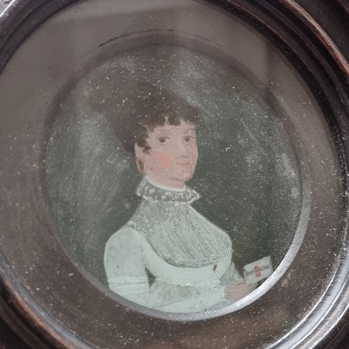 473 - 2 antique painting on glass miniatures in ebonised circular frames, various annotations verso