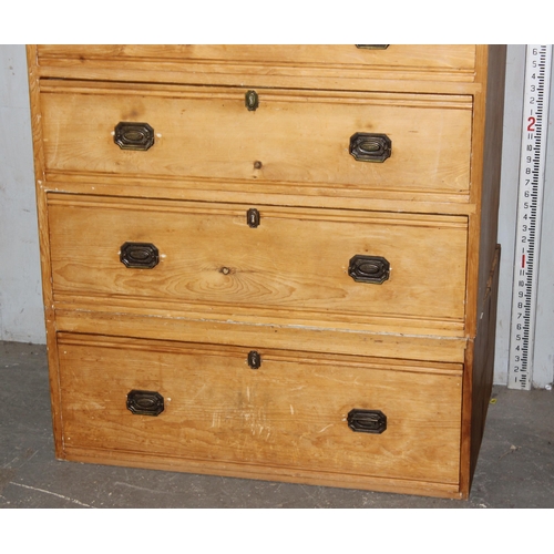 1 - An unusual Victorian pine cupboard consisting of 4 drawers under 2 smaller drawers under a small cup... 