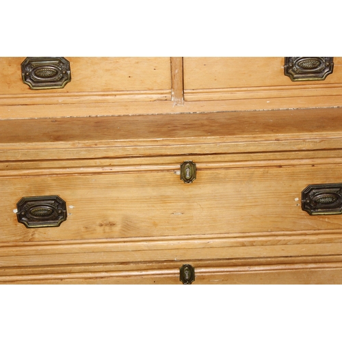 1 - An unusual Victorian pine cupboard consisting of 4 drawers under 2 smaller drawers under a small cup... 