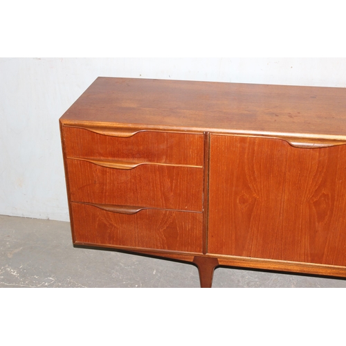 11 - A mid-century McIntosh retro sideboard with 3 drawers and 3 doors, approx 201cm wide