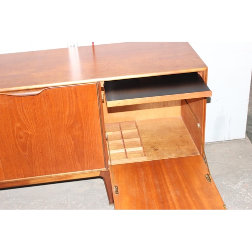 11 - A mid-century McIntosh retro sideboard with 3 drawers and 3 doors, approx 201cm wide