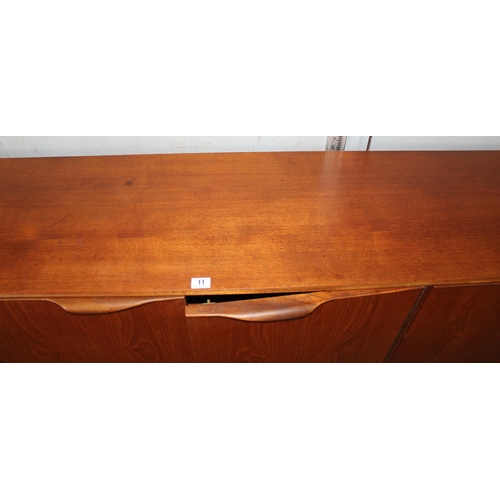 11 - A mid-century McIntosh retro sideboard with 3 drawers and 3 doors, approx 201cm wide