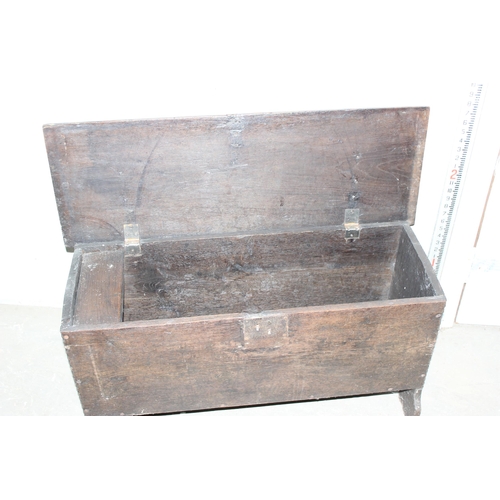 17 - An antique small Elm coffer with carved details, likely 18th century, approx 95cm wide