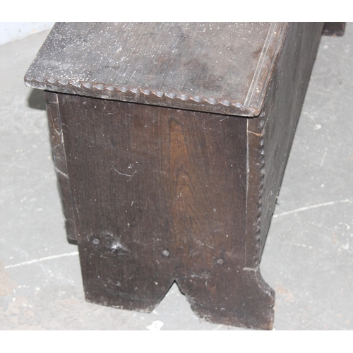 17 - An antique small Elm coffer with carved details, likely 18th century, approx 95cm wide