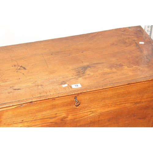 18 - An antique elm coffer with original iron key and bracket fee, approx 95cm wide