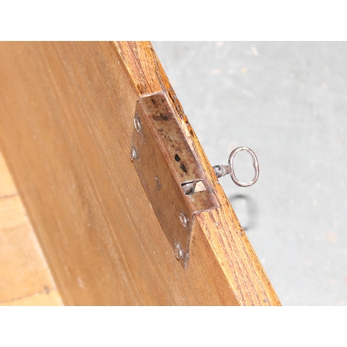 18 - An antique elm coffer with original iron key and bracket fee, approx 95cm wide