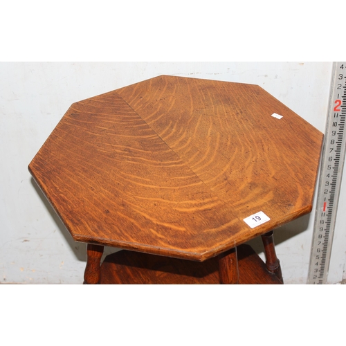 19 - A small early 20th century octagonal oak table with turned legs, approx 54cm wide