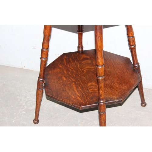 19 - A small early 20th century octagonal oak table with turned legs, approx 54cm wide