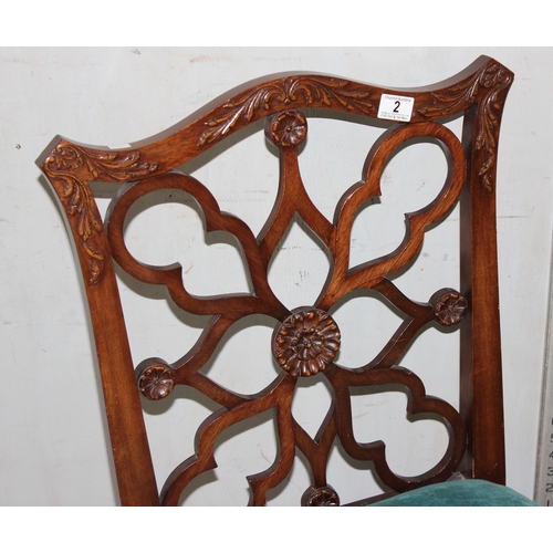 2 - A Georgian mahogany chair with unusual symmetrical designed back and stuffed seat