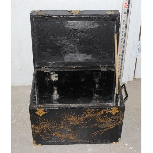 25 - An Oriental black lacquer trunk with brass corners, approx 50cm wide