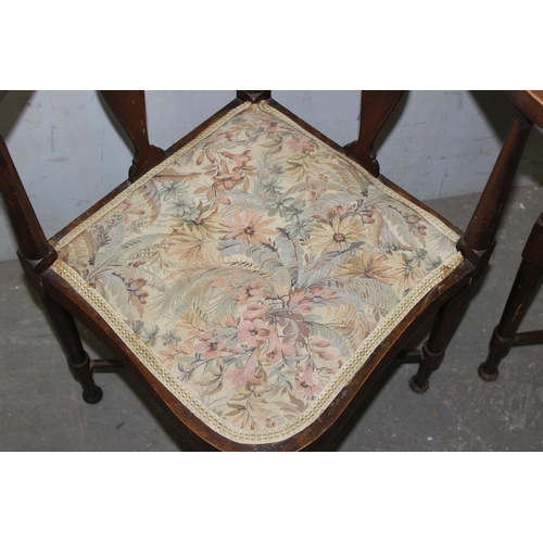 35 - A pair of antique inlaid corner chairs with floral fabric seats