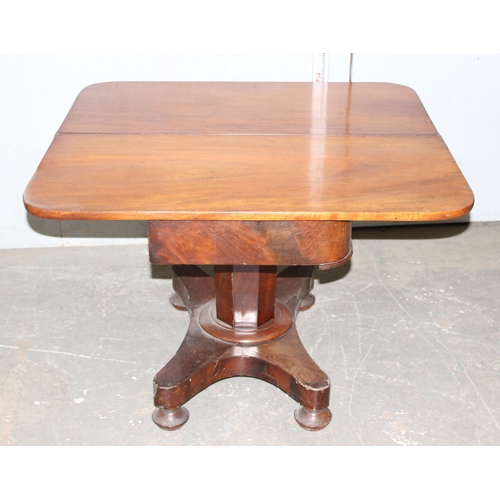 51 - 19th century mahogany fold over tea table on a pedestal base, approx 100cm wide