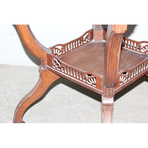 6 - An antique mahogany octagonal topped table with fretwork base depicting Art Deco motifs, approx 75cm... 