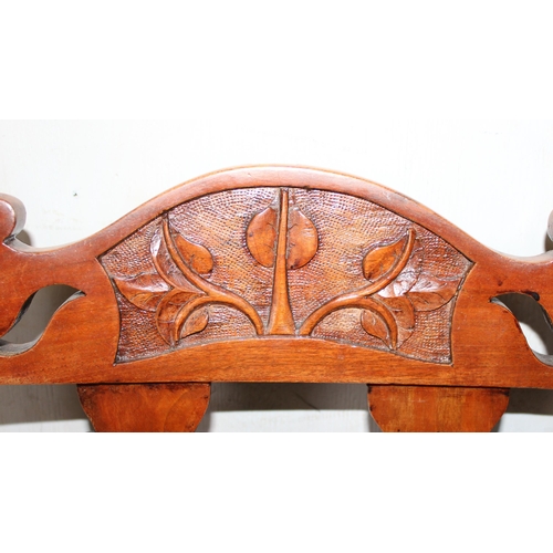 72 - A set of 4 late 19th century chairs with Art Nouveau style carving and stuffed seats