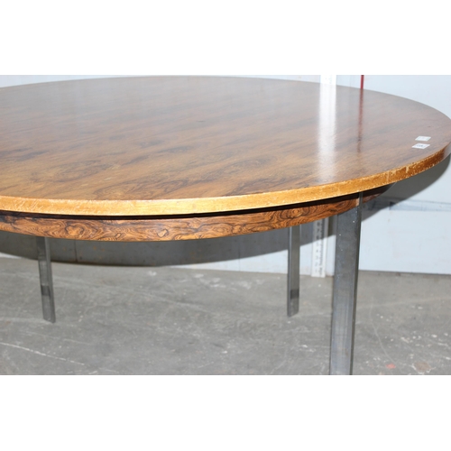 84 - A retro rosewood effect circular dining table with chrome legs, likely Danish but unmarked, approx 1... 