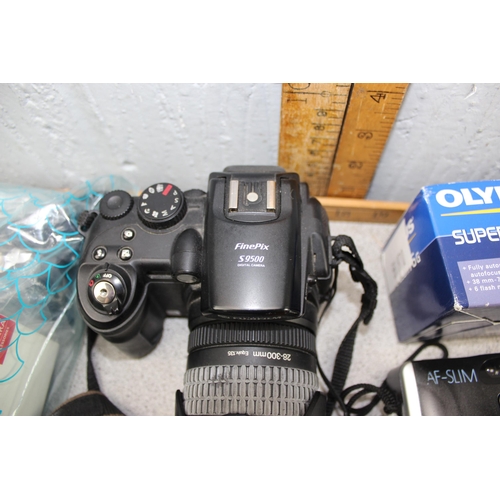 650 - 2 boxes of assorted cameras and accessories, mainly digital to inc Fujifilm S9500, Olympus Superzoom... 