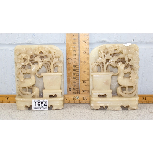 1654 - A pair of Chinese deep relief carved soapstone bookends