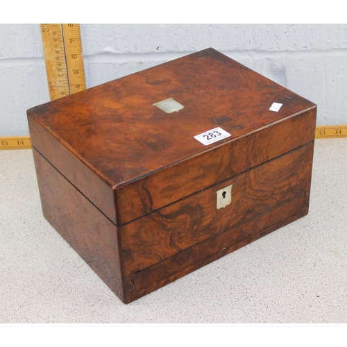 284 - Antique mahogany writing slope with inkwell and brass bound decoration