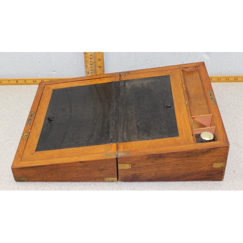 284 - Antique mahogany writing slope with inkwell and brass bound decoration