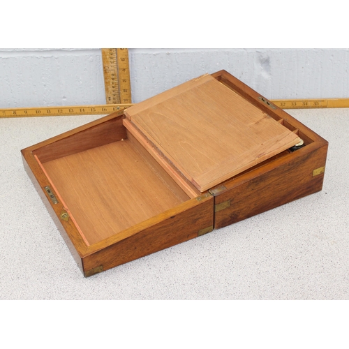 284 - Antique mahogany writing slope with inkwell and brass bound decoration