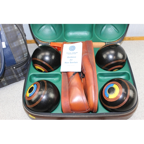 725 - 2 sets of bowling balls in bags