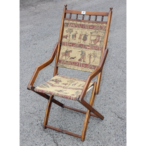 96 - Antique folding campaign chair with later upholstery