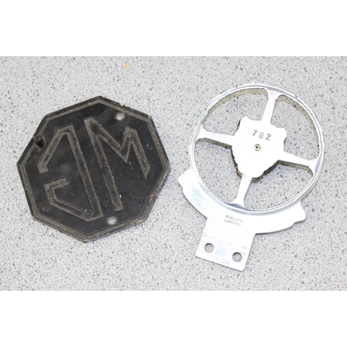 743 - A Jaguar owners club badge and an MG car badge (2)